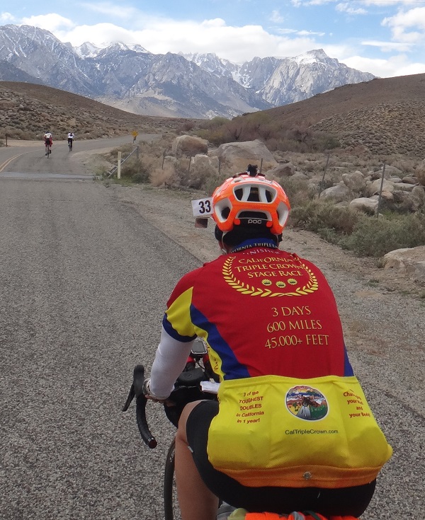 Peg Miller climbs Lubken Canyon Road on the 2016 Southern Inyo Double in her hard earned Red California Triple Crown Stage Race Jersey
